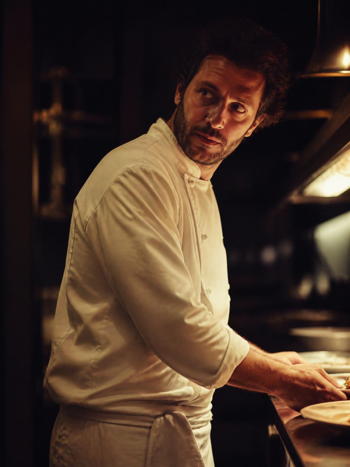 Chef E. Laurent plating at service